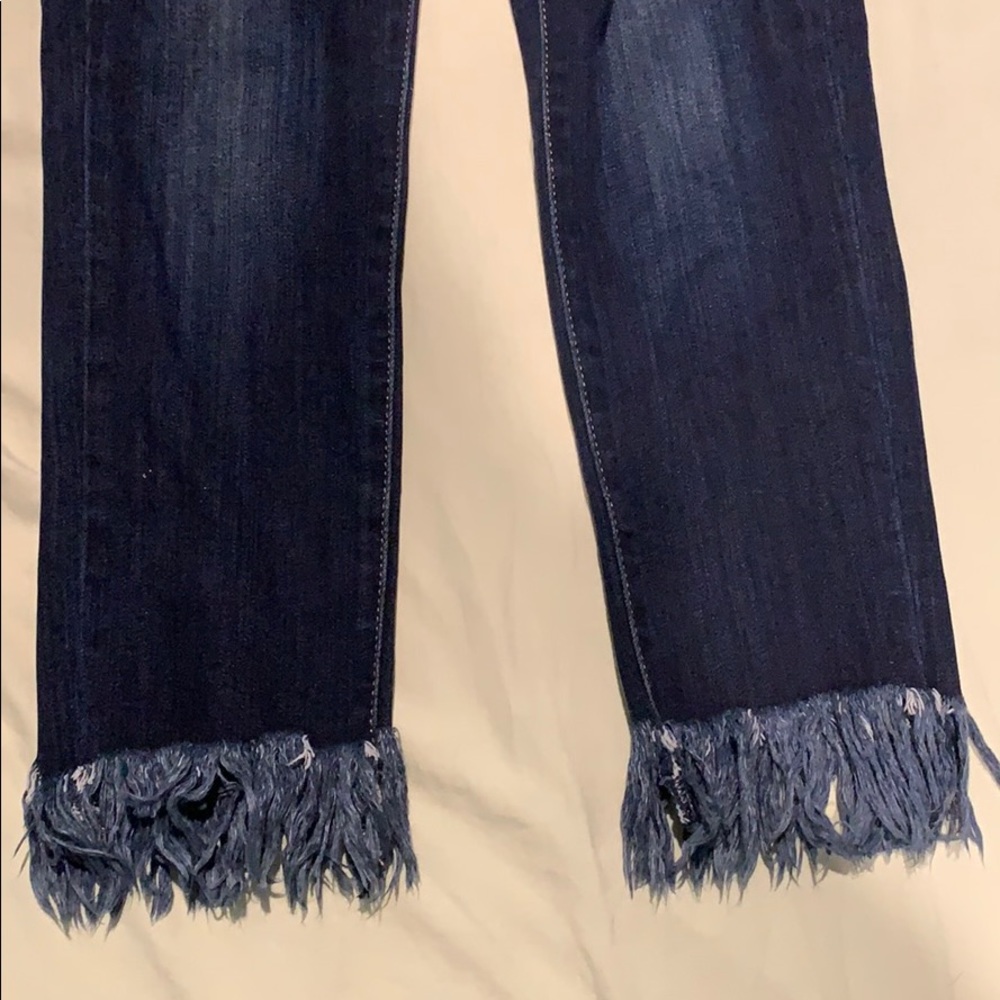 Dark wash fringe bottom skinny jeans